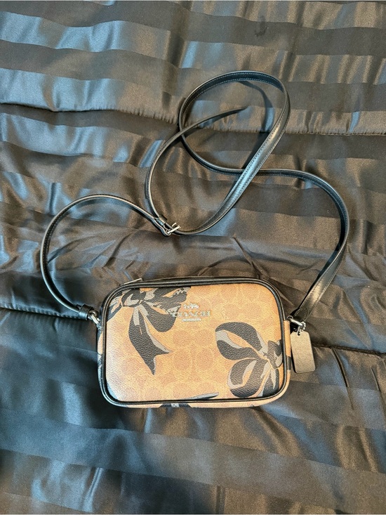 Coach Handbags - Coach Brown Floral Print Crossbody with Black Strap